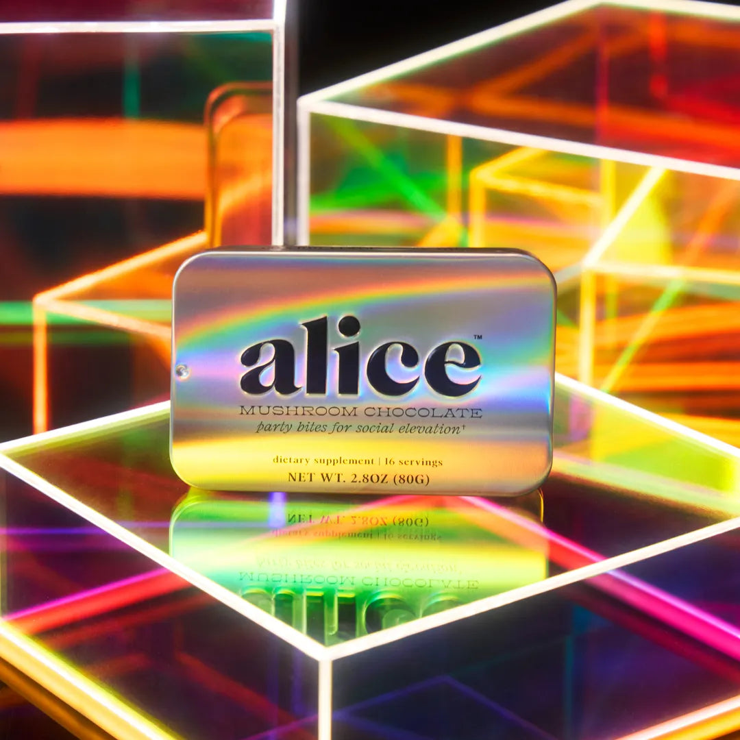 Iridescent packaging of 'alice' mushroom chocolate with a colorful geometric background